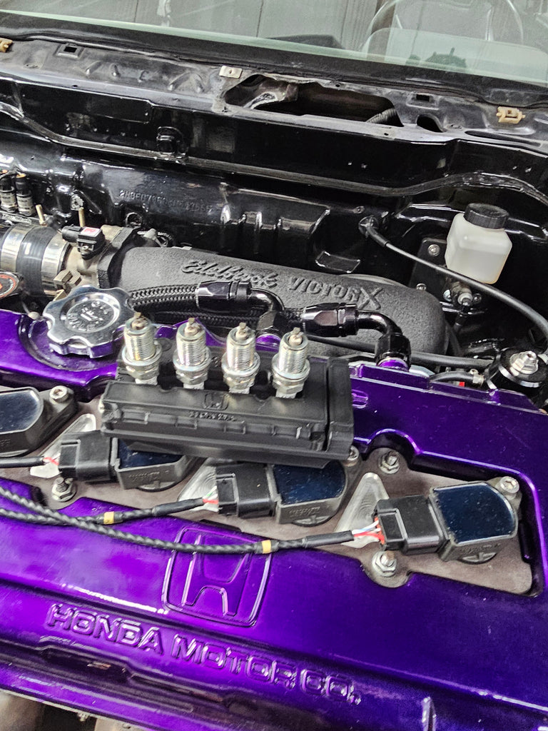 B series spark plug holder